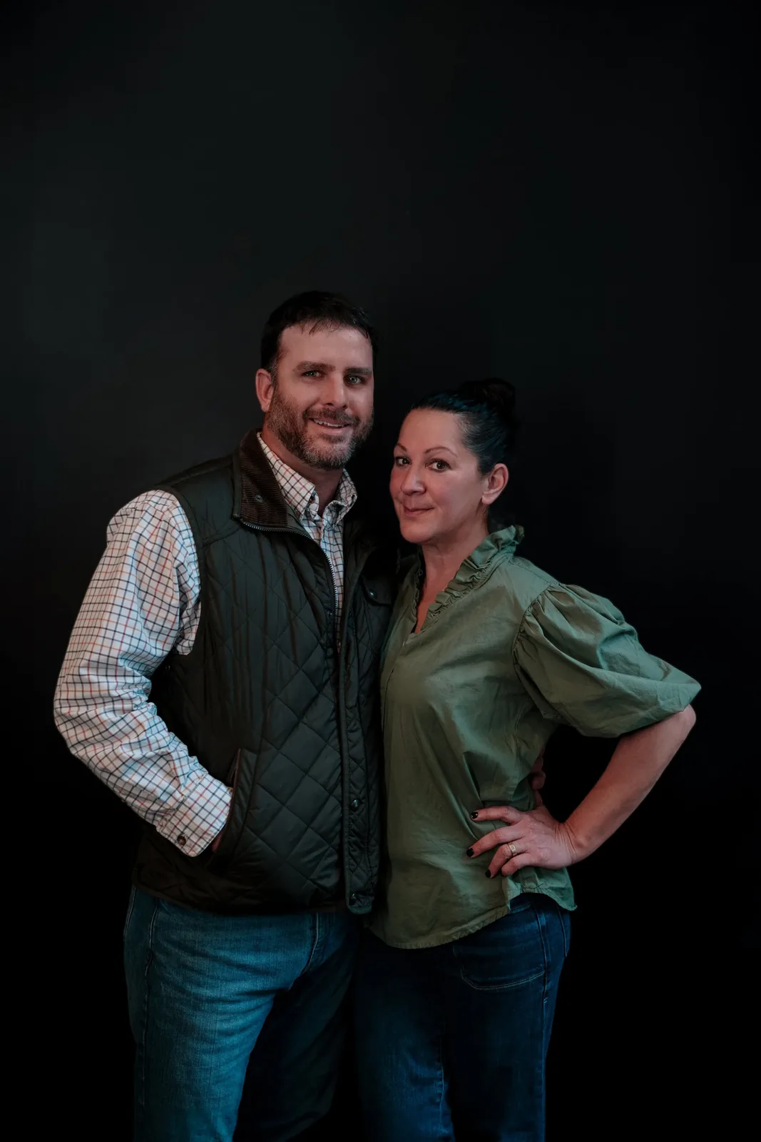 Brian and Melanie McCaffree, the founders of Bistro Ten, photographed against a dark backdrop