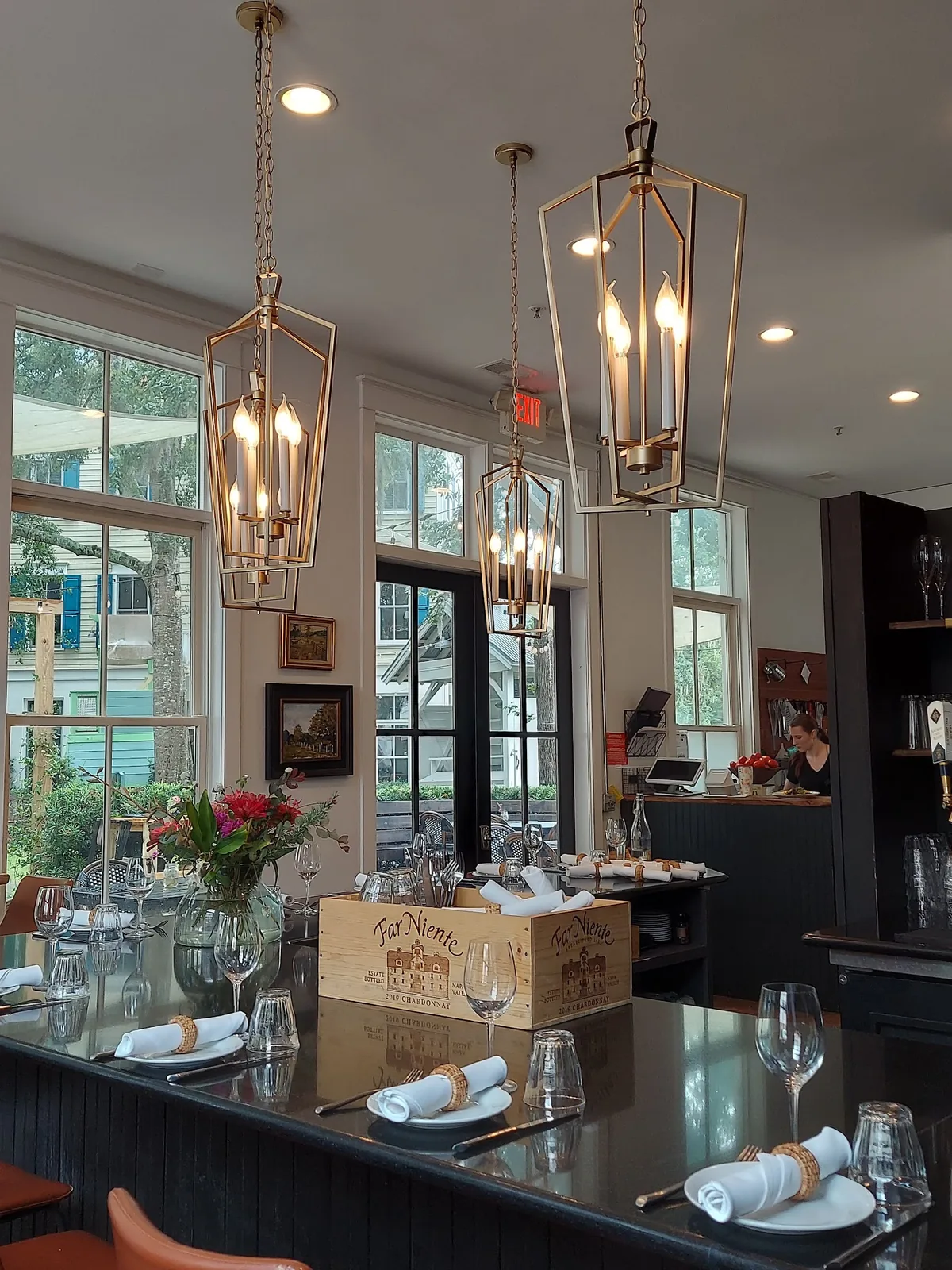 Daylight across the tables and bar inside Bistro Ten