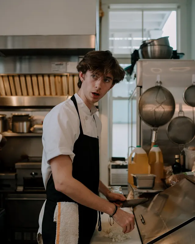 A young cook working the line in the Bistro Ten kitchen